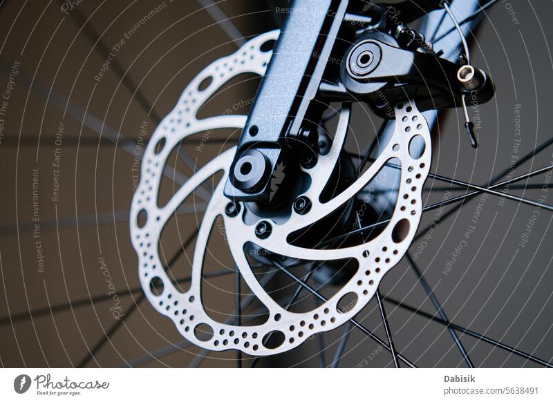 Part of bicycle braking system, brake disk and brake pads bike disc brake wheel brakes friction maintenance service repair ride hydraulic detail white metal