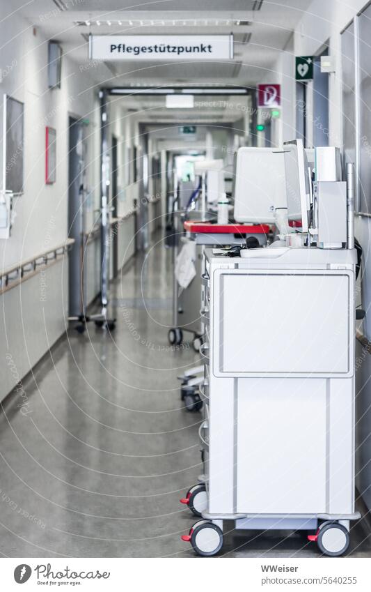 There are trolleys and equipment in the hospital corridor. This is the nurses' base care Carer medicine clinic Hospital Sick Provision Hallway Corridor Sterile