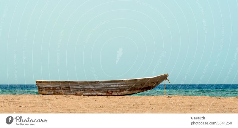 old boat on the sand against the sea Red Sea background beach blue coast color day dirty fisherman fisherman boat fishing horizon landscape nature nervous