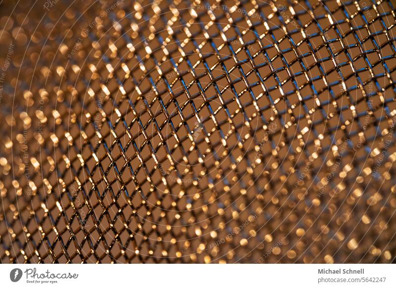 Golden wire mesh golden Grating Pattern Structures and shapes Metal Abstract Sieve background Background picture glittering macro Macro (Extreme close-up)