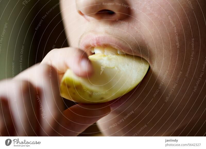 Unrecognizable young girl biting into a fresh, juicy piece of apple Girl Apple Bite Juicy Fresh Slice Healthy Fruit Vitamin Nutrition Eating Delicious Food