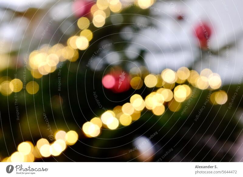 Bokeh of a Christmas tree detail with fairy lights and red Christmas tree baubles Christmas & Advent Christmas decoration fir tree Decoration