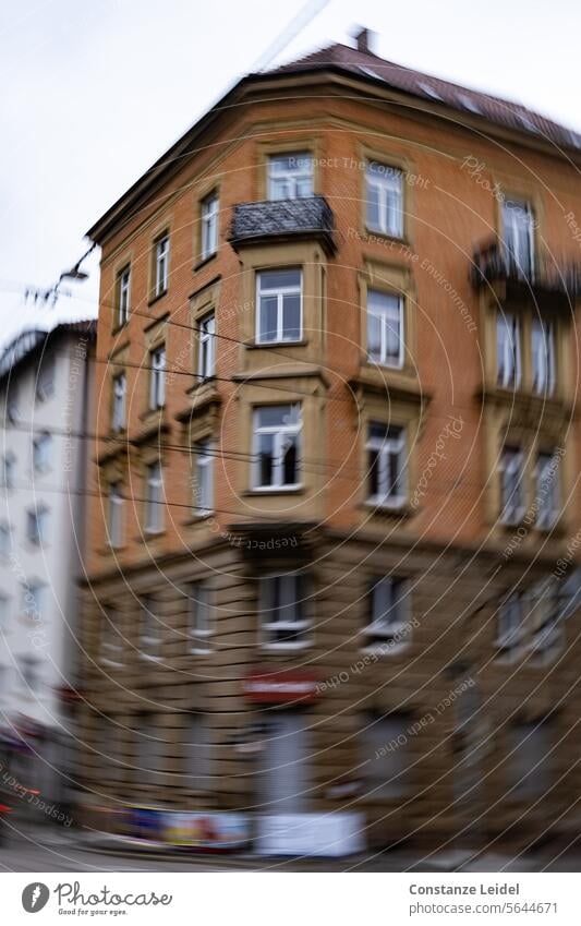 Brick corner house using ICM technology blurred motion blur Brick-built house Apartment Building hazy downtown fake Giddy Rotate turn turning Brown Window