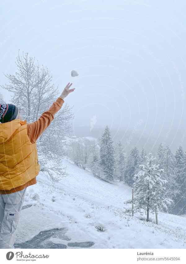 boy throwing snowball winter wintermood Snow outdoor