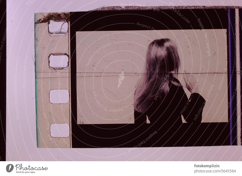 young woman on a negativ haare rückenansicht retro film Analog Nostalgia Photography Film industry Negative 35mm Old 35mm film Cinema Exposure Retro