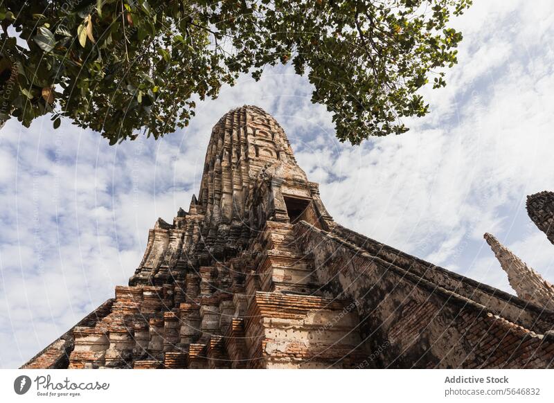 Ancient Buddhist temple against blue sky during daytime in Thailand thai ancient pagoda buddhist building architecture religion heritage historic thailand