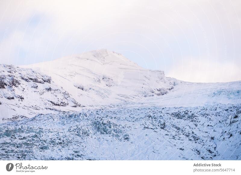 Snow-covered mountain landscape in Iceland iceland snow wilderness serene pastel sky icy snow-covered view nature outdoors tranquil scenic beauty winter cold