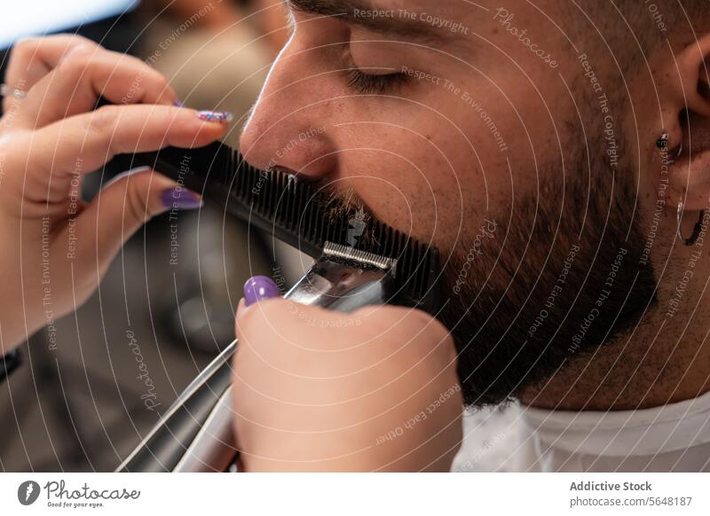 Barber cutting male client's mustache with electric trimmer Hairdresser Trimmer Mustache Man Salon Care Service Hand Client Comb Tool Beard Job Hairstylist