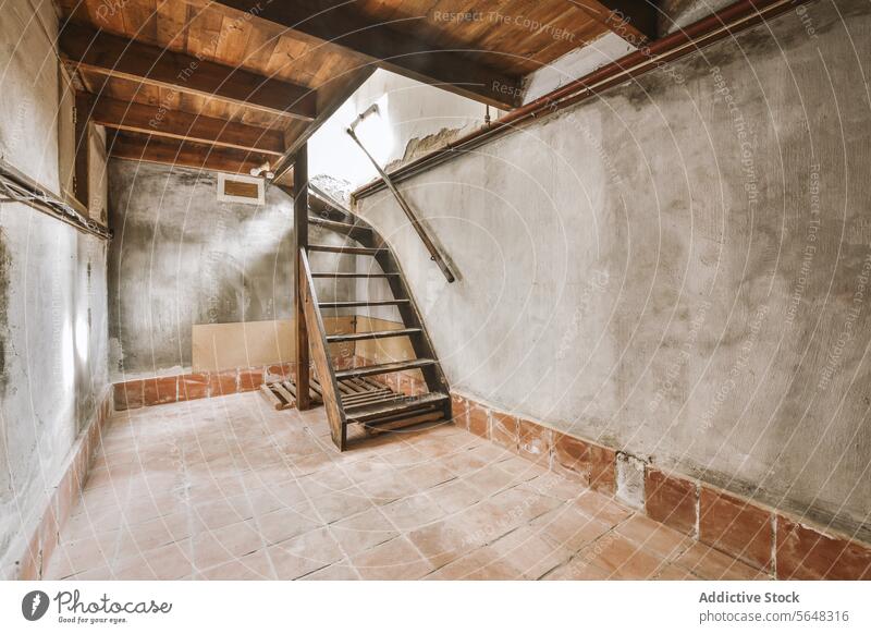 Wooden staircase in empty room wooden steps stairs old rusty weathered texture wall floor ceiling dirty aged pattern dingy indoor day railing sunlight grimy