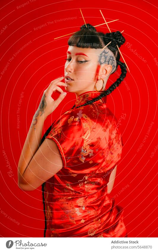 Traditional red dress and modern tattoos on a woman asian traditional portrait style culture fashion background young contemporary stylized female elegance
