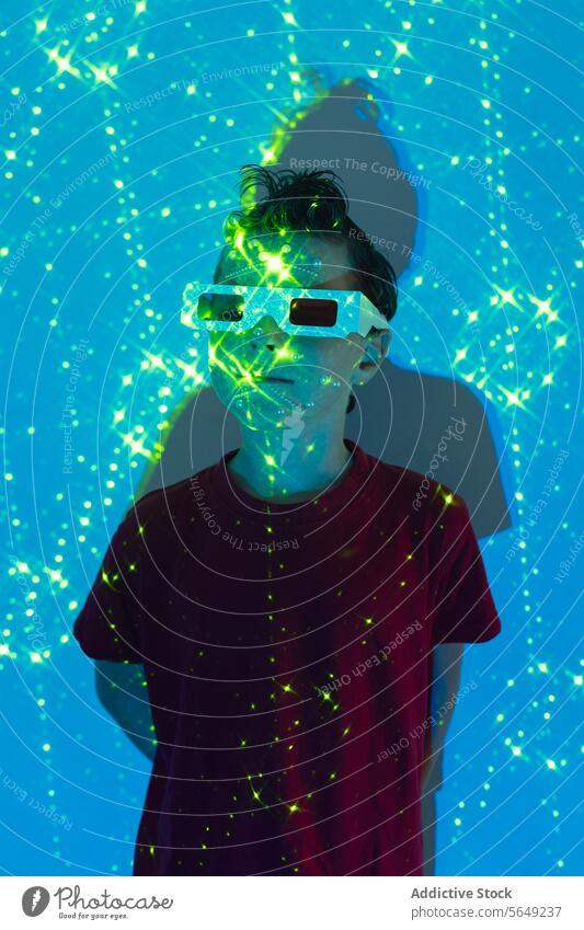 Adorable kid wearing 3D glasses in neon studio with blue and green lights Boy Glasses Glow Neon Light Entertain Carefree Futuristic Illuminate Childhood Cute
