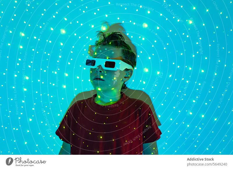Adorable kid wearing 3D glasses in neon studio with blue lights Boy Glasses Glow Neon Light Entertain Carefree Futuristic Illuminate Childhood Cute Kid
