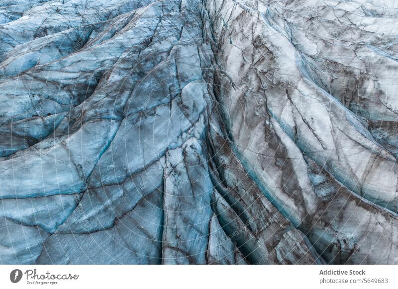 Top view close up of textured dry surface of massive Vatnajokull glacier with cracks in Iceland on winter day ice snow landscape nature formation volcanic