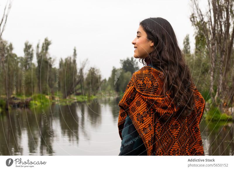 Woman in serenity on Xochimilco Canals woman shawl canal water peace Mexico City trajinera dawn local Ajolotario Mexican Ajolote endangered salamander biologist