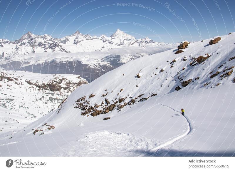 High angle of unrecognizable tourists skiing on snow-capped mountain in Zermatt under blue sky Ski Snow Mountain Skier Landscape Majestic Adventure Winter
