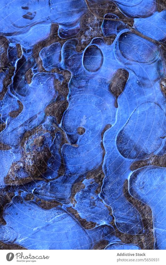 Abstract patterns of blue ice with a hint of brown rock, revealing the intricate beauty of winter's first frost abstract cold texture natural crystalline water