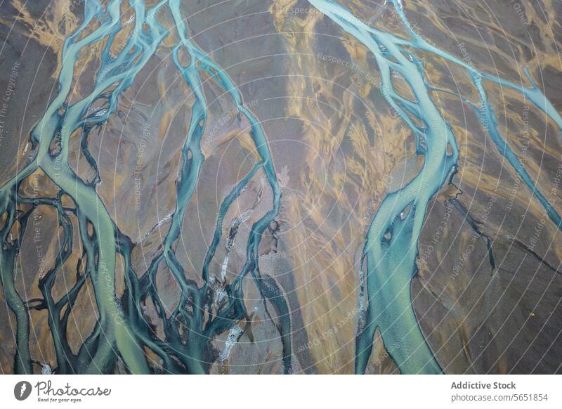 Braided Rivers Carving Through Icelandic Terrain aerial rivers braided highlands terrain landscape carving snaking nature waterways aerial view geography