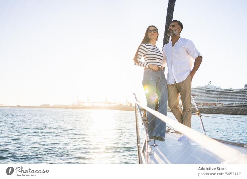 Happy couple standing on seafront trip travel yacht romantic love enjoy happy tourism modern boat positive journey coast smile marine water girlfriend shore