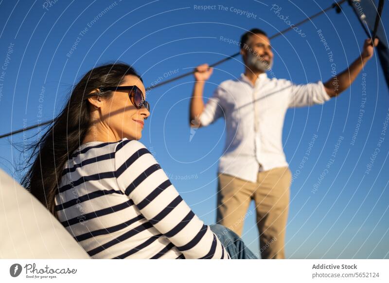 Smiling couple having fun while holding rope in hand happy enjoy smile affection glad fondness optimist positive pleasant wife comfort hug satisfied partner