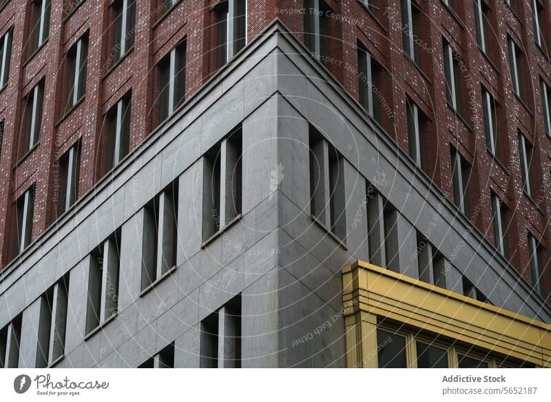 Abstract architectural detail of a modern corner building with contrasting yellow elements in Rotterdam architecture abstract urban city brick window