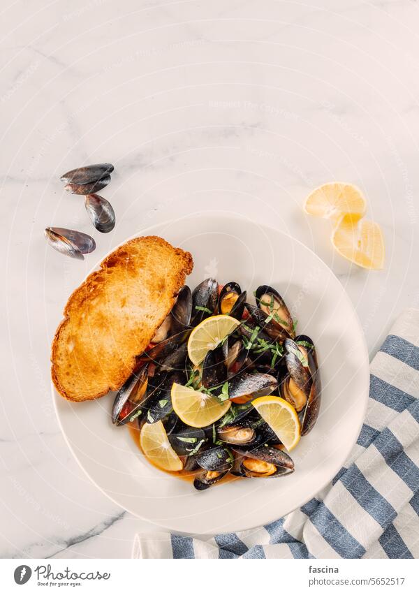 cooked mussels with lemon in white bowl moules seafood background kitchen dish delicious fresh meal dinner cuisine gourmet lunch mossels tasty shellfish cooking
