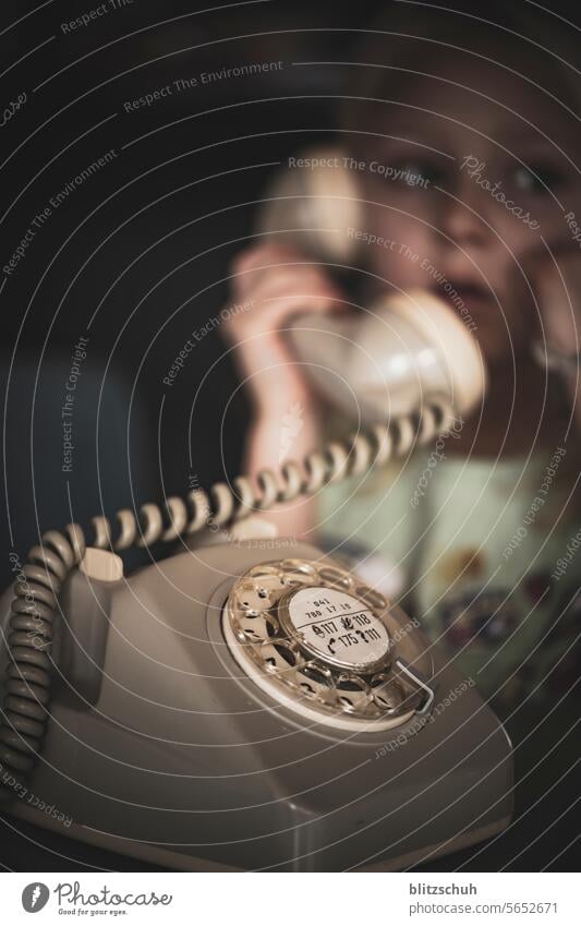 Girl with an old rotary dial telephone Telephone Telecommunications To call someone (telephone) Rotary dial Digits and numbers Receiver Communicate Retro