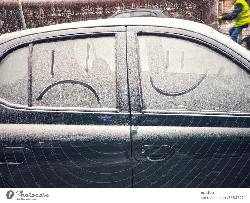 The joys and sorrows of driving car Car window Smileys Mature Snow Winter Good and bad Exterior shot Passenger side