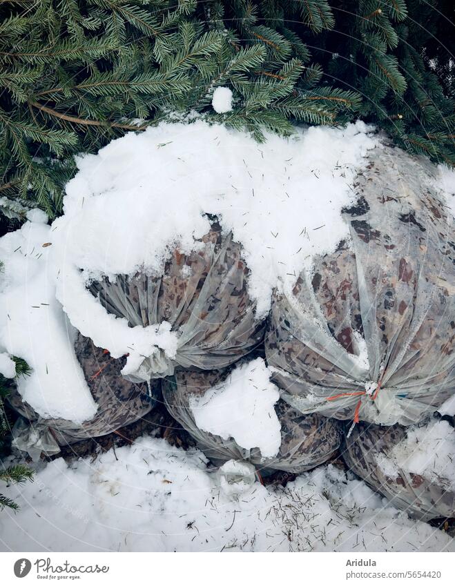 Get rid of them! | Bags of leaves and Christmas trees in the snow, waiting to be disposed of by the roadside Snow Leaf bags foliage Fir tree fir tree Winter