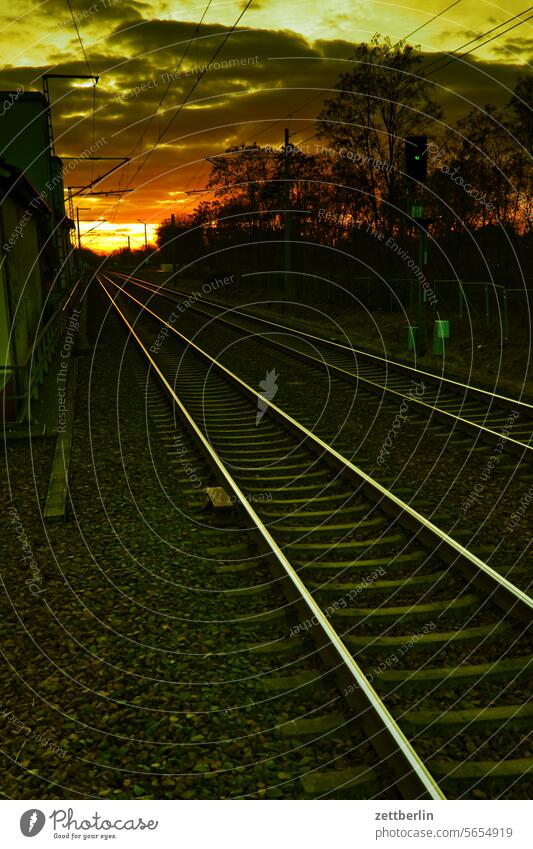 Rails in the sunset Train station Railroad Track bed voyage rail Rail transport threshold Transport vacation go away Schedule (transport) train delay Lateness