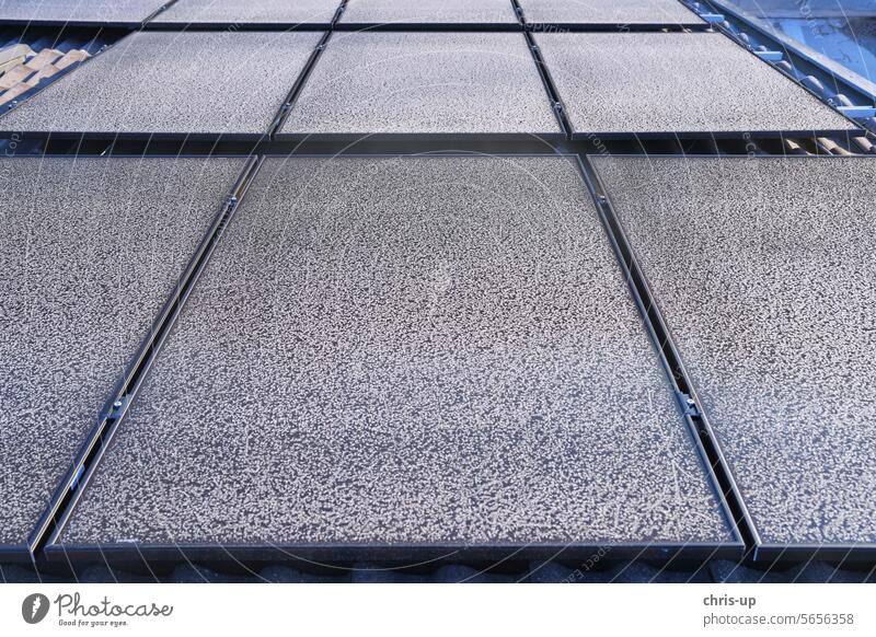 Frost patterns on photovoltaic modules on a cold, sunny winter's day photovoltaics Winter solar Sun Renewable energy revolution solar panel Solar collector
