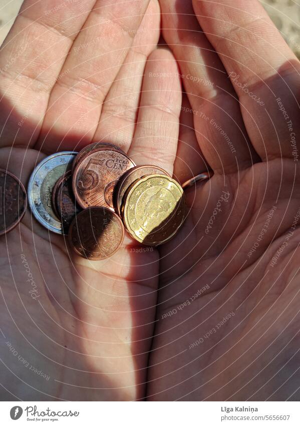 Holding money in palm Euro cents Money Coins Save Loose change small change Cent euro coins Paying Hand Poverty palms Palm of the hand