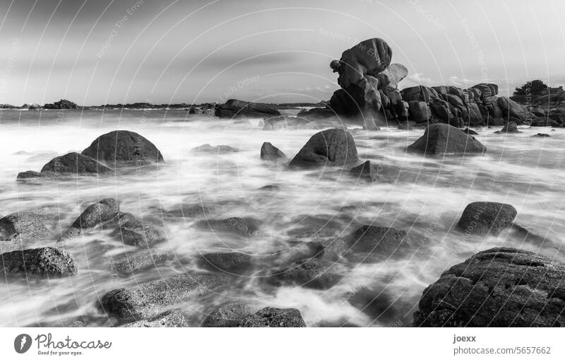 Sea surf on a rocky coast in black and white, long-term France wildly romantic Day Deserted Landscape stones Exterior shot Horizon Rock Waves Sky Ocean Water