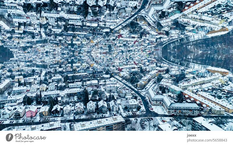 Parallel world: Houses of a wintry city reflected on the horizon parallel world parallel company overhead Bird's-eye view Above Horizon reflection surreal