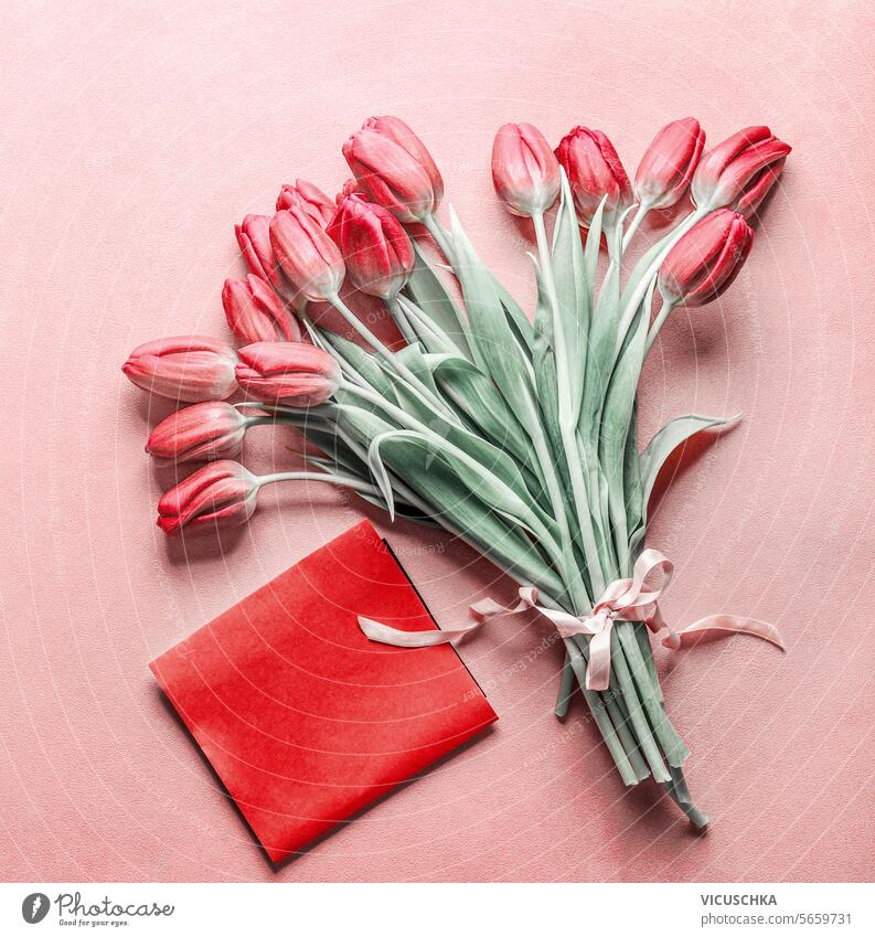 Bunch of tulips with blank red greeting card on pink background, top view. Valentine's Day concept valentines day bunch mothers day birthday holiday beautiful