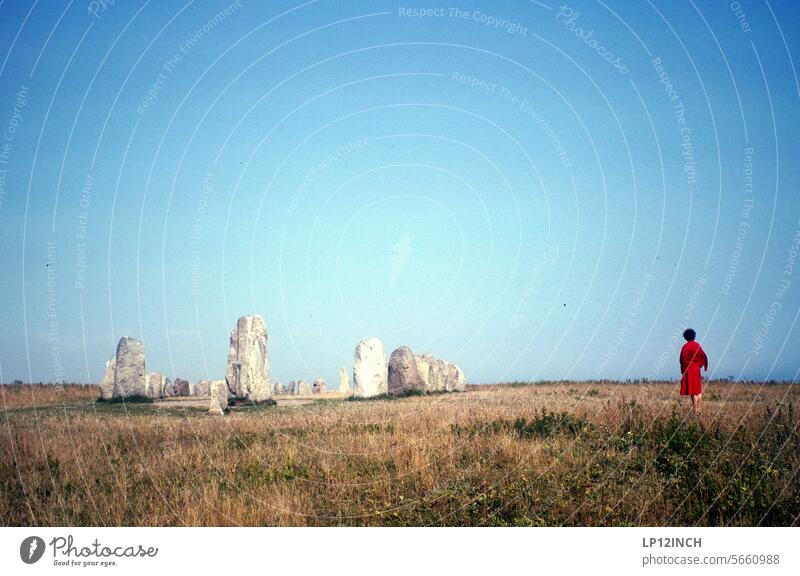 Times past VIII. Woman in red Stone circle Red vacation tourist Trip Destination Scandinavia Tourism Landscape travel Vacation & Travel Summer Analog
