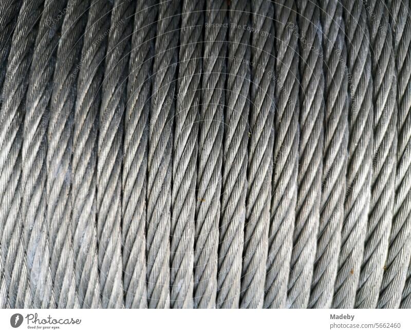 Robust shiny silver steel cable on a drum in the Bielefeld climbing park on Johannisberg in the Teutoburg Forest on the Hermannsweg in East Westphalia-Lippe