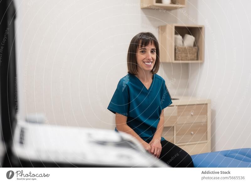 Smiling healthcare worker in a modern clinic setting professional woman smiling office sitting medical nurse doctor practitioner health staff medicine