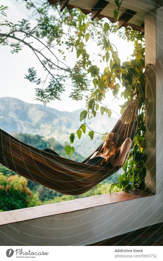 Relaxing in a hammock with a scenic mountain backdrop in Minca, Colombia relaxation nature greenery peaceful tranquility leisure outdoor view foliage striped