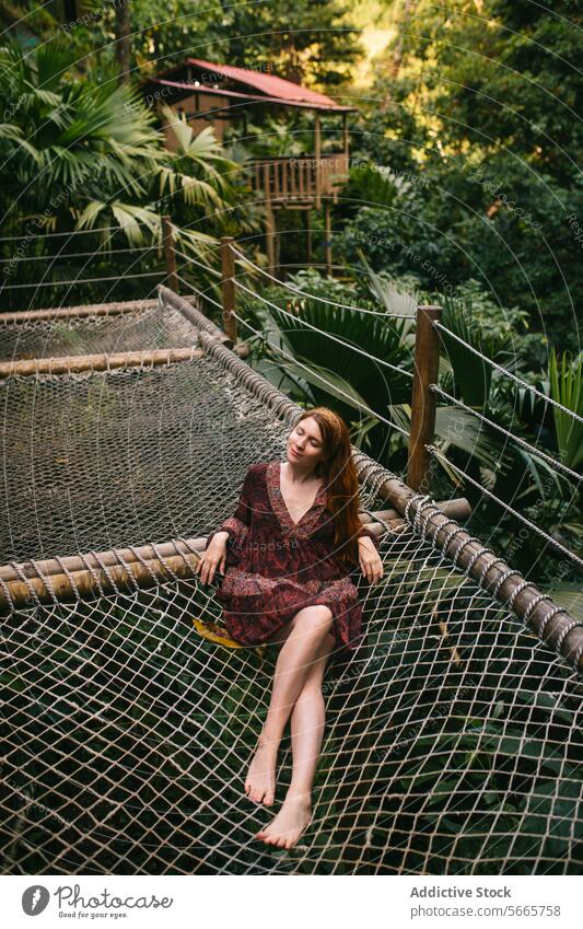 Serene Jungle Retreat with Relaxed Young Woman in Minca, Colombia woman jungle retreat hammock lush foliage tranquility nature relaxation casual clothing
