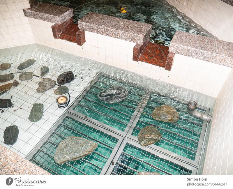 Decorative fountain with turquoise base, marble and stones Ornamental fountain Well water landscape Turquoise Retro 80s 90s Shopping malls Water Marble Grating