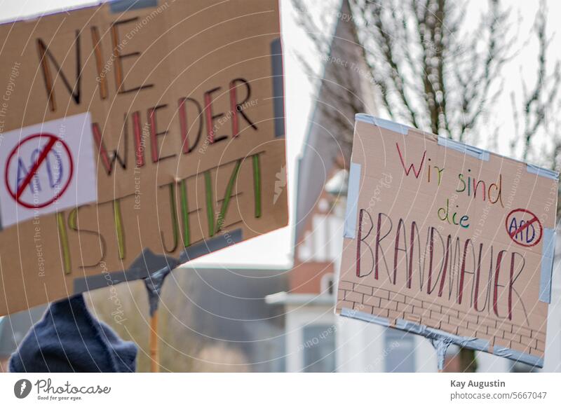 Protest posters against the right Protest placards Sylt town hall square Demo Signs Lettering Never again Fire wall interdiction Clue never again Poster