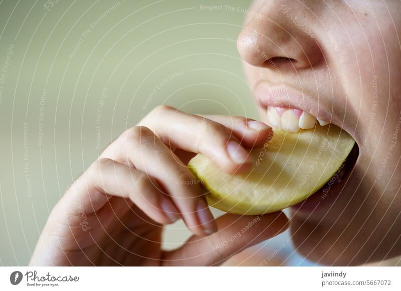 Anonymous teenage girl eating fresh apple slice Girl Apple Eat Slice Fresh Healthy Vitamin Nutrition Fruit Bite Yellow Food Delicious Teen Tasty Sweet Hungry