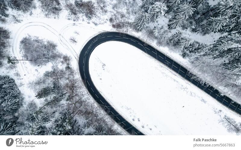 Winter Wonderland Aerial View: Snowy Streets Captured by Drone above adventure aerial photography aerial road aerial view aerial winter asphalt background