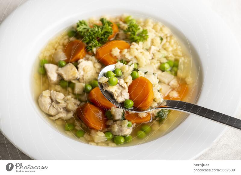 Chicken soup with bread at a glance Chicken broth supervision Noodle soup Soup Stock chicken Noodles Stars Meat Pea carrot salubriously Meal Eating Dinner
