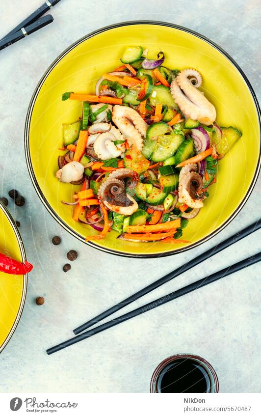Octopus salad with cucumber, Korean food. octopus seafood octopus salad plate flat lay top view onion fresh dish healthy appetizer gourmet cuisine vegetable