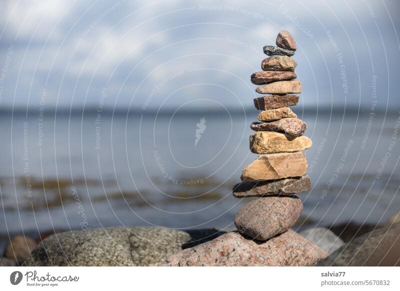 Cohesion and balance | Stone tower by the sea stone tower Tower Balance Unwavering Ocean stones Beach Relaxation Stack coast Water Nature Calm Meditation