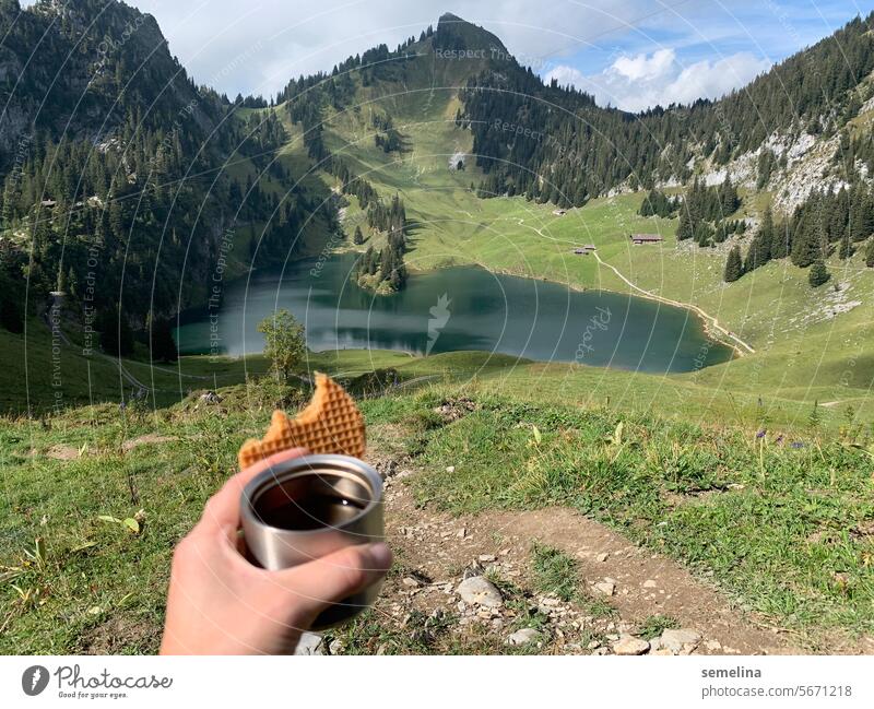 Tea and waffle break with a view of the Alps Break To enjoy Beverage mountain lake Relaxation Waffle Bite Landscape Thermos coffee pot Hiking Trip