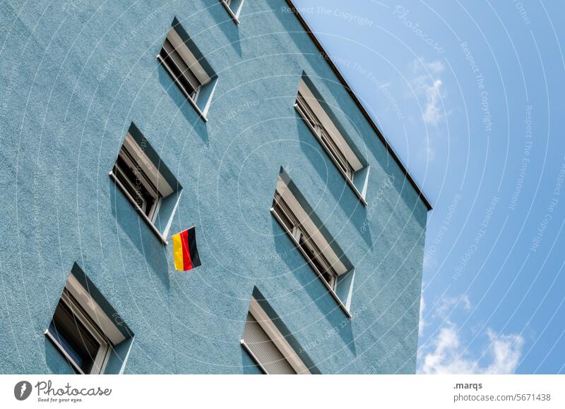 Typically German | a bit of patriotism Worm's-eye view House (Residential Structure) Apartment house Blue Sky Beautiful weather Window German Flag flag