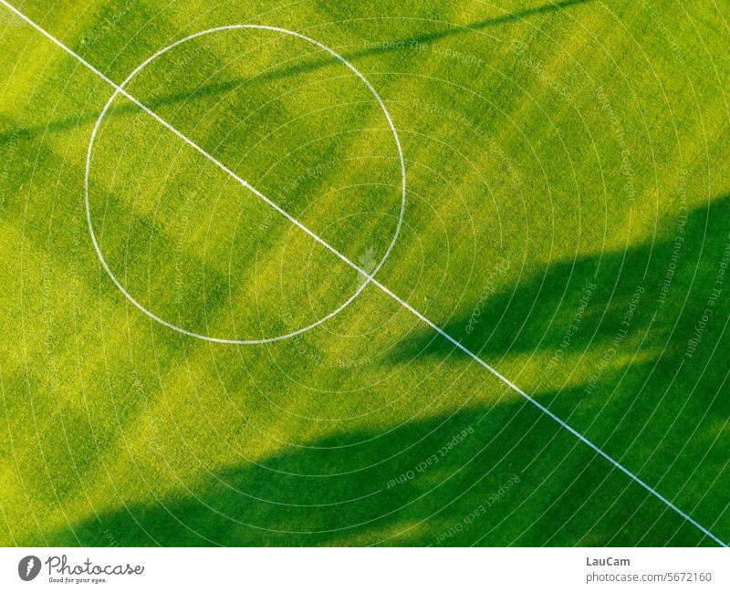 midfield Foot ball Football pitch Ball sports Green Lawn Sporting grounds Playing field Grass surface Markings Bird's-eye view droning drone photo Sports