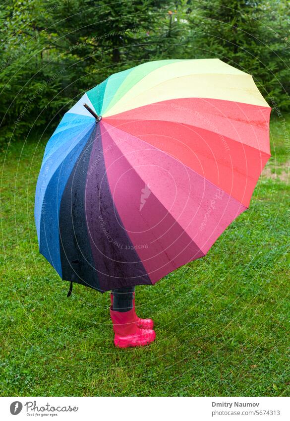 Child with umbrella outdoors autumn boot child colored drops forecast girl grass gumboots hiding holding kid little meadow multi nature one park rain rainboots